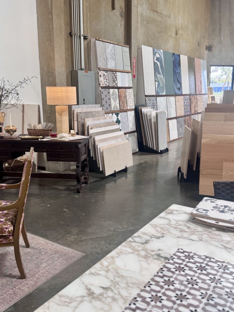 Showroom desk with a table lamp and large material samples